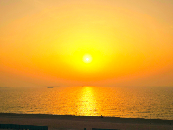 Daily sunset with sandy beach view